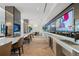 Resident lounge featuring a long bar with multiple TVs and a sink at 2425 Peachtree Rd # 1806, Atlanta, GA 30305