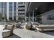 Modern condominium with outdoor patio and lounge seating area with views of city at 2425 Peachtree Rd # 1806, Atlanta, GA 30305