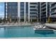 Modern pool area featuring a tanning ledge and lounge chairs, set against the backdrop of a high-rise building at 2425 Peachtree Rd # 1806, Atlanta, GA 30305