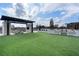 Rooftop terrace featuring a pergola, outdoor kitchen, and synthetic grass at 2425 Peachtree Rd # 1806, Atlanta, GA 30305