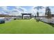 Rooftop terrace featuring a pergola, outdoor kitchen, and synthetic grass at 2425 Peachtree Rd # 1806, Atlanta, GA 30305