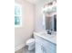 Bright bathroom showcasing a white vanity with a quartz countertop and a modern sink at 2646 Radvell Ct, Decatur, GA 30034