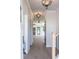 Bright hallway featuring hardwood floors, modern lighting fixtures, and views into other rooms at 2646 Radvell Ct, Decatur, GA 30034