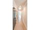 Long hallway with wooden floors and multiple doors that lead to other rooms at 2646 Radvell Ct, Decatur, GA 30034