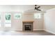 Cozy living room featuring hardwood floors, a modern fireplace, and bright windows at 2646 Radvell Ct, Decatur, GA 30034