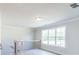 Bright upstairs landing with wooden floors and a window that offers natural light at 2646 Radvell Ct, Decatur, GA 30034