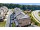 Aerial view of a multi-Gathering residential neighborhood with lush landscaping, and a winding street at 414 Montclair Ct, Woodstock, GA 30188