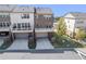 A view of the home's backyard area, showcasing the garage entrance and outdoor green space at 414 Montclair Ct, Woodstock, GA 30188