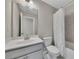 Bathroom featuring a white vanity with marble countertop, a large mirror, and tile flooring at 414 Montclair Ct, Woodstock, GA 30188