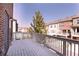 Open outdoor deck space with wooden railings overlooking neighboring houses and landscaping at 414 Montclair Ct, Woodstock, GA 30188