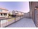 Spacious deck with wooden railings overlooking neighboring houses and a blue sky at 414 Montclair Ct, Woodstock, GA 30188