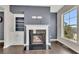 Living room featuring a fireplace with marble hearth and built in shelving at 414 Montclair Ct, Woodstock, GA 30188