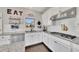 Modern kitchen featuring white cabinets, granite countertops, and stainless steel appliances at 414 Montclair Ct, Woodstock, GA 30188