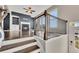 Open-concept living room with dark wood floors, fireplace, and access to the balcony at 414 Montclair Ct, Woodstock, GA 30188