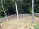 A fenced backyard featuring mature trees with a hammock, offering a private outdoor space at 1101 Senator Rd, Douglasville, GA 30134