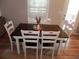 Inviting dining room featuring a wood table with white chairs and natural light at 1101 Senator Rd, Douglasville, GA 30134