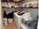Functional laundry room with shelving, washer, and dryer at 1101 Senator Rd, Douglasville, GA 30134