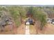 An aerial shot reveals the home's placement among mature trees and landscaping at 122 Lakepointe Court Ct, Stockbridge, GA 30281