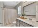 Bright bathroom features a shower, vanity, mirror, and natural light from the window at 122 Lakepointe Court Ct, Stockbridge, GA 30281