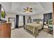 This bedroom features a ceiling fan, closet, and windows that provide natural light at 122 Lakepointe Court Ct, Stockbridge, GA 30281