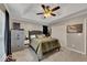 This bedroom features a ceiling fan, closet, and windows that provide natural light at 122 Lakepointe Court Ct, Stockbridge, GA 30281