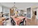 A dining room and kitchen area with hardwood floors and bright natural light at 122 Lakepointe Court Ct, Stockbridge, GA 30281