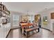 A dining room and kitchen area with hardwood floors and bright natural light at 122 Lakepointe Court Ct, Stockbridge, GA 30281