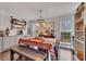 A dining room and kitchen area with hardwood floors and bright natural light at 122 Lakepointe Court Ct, Stockbridge, GA 30281