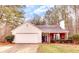 Charming single-story home with a manicured lawn, two-car garage, and inviting entrance at 122 Lakepointe Court Ct, Stockbridge, GA 30281