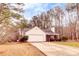 Single-story house with ample parking and a neatly landscaped front yard at 122 Lakepointe Court Ct, Stockbridge, GA 30281