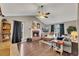 Cozy living room with a brick fireplace, vaulted ceilings, and natural light at 122 Lakepointe Court Ct, Stockbridge, GA 30281