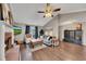 Comfortable living room featuring a brick fireplace, ample seating, and a bright atmosphere at 122 Lakepointe Court Ct, Stockbridge, GA 30281