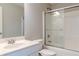 Bathroom with a tub and shower, bright lighting and a modern sink at 190 Holcomb Ct, Fayetteville, GA 30215