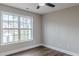 Bedroom featuring wood-look floors and a window view at 190 Holcomb Ct, Fayetteville, GA 30215