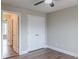 Bedroom featuring a closet, door, neutral walls and dark, solid surface flooring at 190 Holcomb Ct, Fayetteville, GA 30215