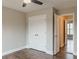 Bedroom with closet and hardwood floors; entrance open to another bedroom at 190 Holcomb Ct, Fayetteville, GA 30215