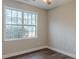 Bedroom showcases hardwood floors, neutral paint, one window and baseboard trim at 190 Holcomb Ct, Fayetteville, GA 30215