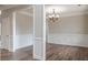 Formal dining room with wood floors, wainscoting, and modern chandelier, ideal for Gathering gatherings at 190 Holcomb Ct, Fayetteville, GA 30215