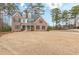 Charming two-story brick home with black shutters, dormer windows, and a spacious front lawn at 190 Holcomb Ct, Fayetteville, GA 30215