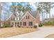 Charming two-story brick home with black shutters, dormer windows, and a spacious front lawn at 190 Holcomb Ct, Fayetteville, GA 30215