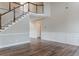 Open foyer featuring a staircase with wood banister and decorative wall paneling at 190 Holcomb Ct, Fayetteville, GA 30215