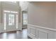 Elegant foyer with wood floors, wainscoting, and a bright front door, creating a grand entrance at 190 Holcomb Ct, Fayetteville, GA 30215