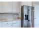 Kitchen featuring white cabinets and stainless steel appliances at 190 Holcomb Ct, Fayetteville, GA 30215