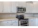 Updated kitchen with white cabinets and stainless steel appliances at 190 Holcomb Ct, Fayetteville, GA 30215