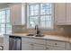 Bright kitchen featuring white cabinets and stainless steel appliances at 190 Holcomb Ct, Fayetteville, GA 30215