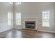 Bright living room featuring a brick fireplace and large windows at 190 Holcomb Ct, Fayetteville, GA 30215