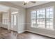 Inviting living room with lots of windows, wood floors and neutral paint, perfect for entertaining at 190 Holcomb Ct, Fayetteville, GA 30215