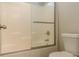 Shower featuring a sliding glass door, shower head and grab bar at 190 Holcomb Ct, Fayetteville, GA 30215