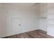 This spacious walk-in closet features custom shelving and vinyl flooring at 190 Holcomb Ct, Fayetteville, GA 30215