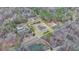 High aerial view of large lot with older house and outbuildings, outlined in yellow at 2111 Jade Dr, Canton, GA 30115